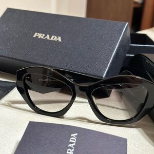 Prada logo sunglasses.
